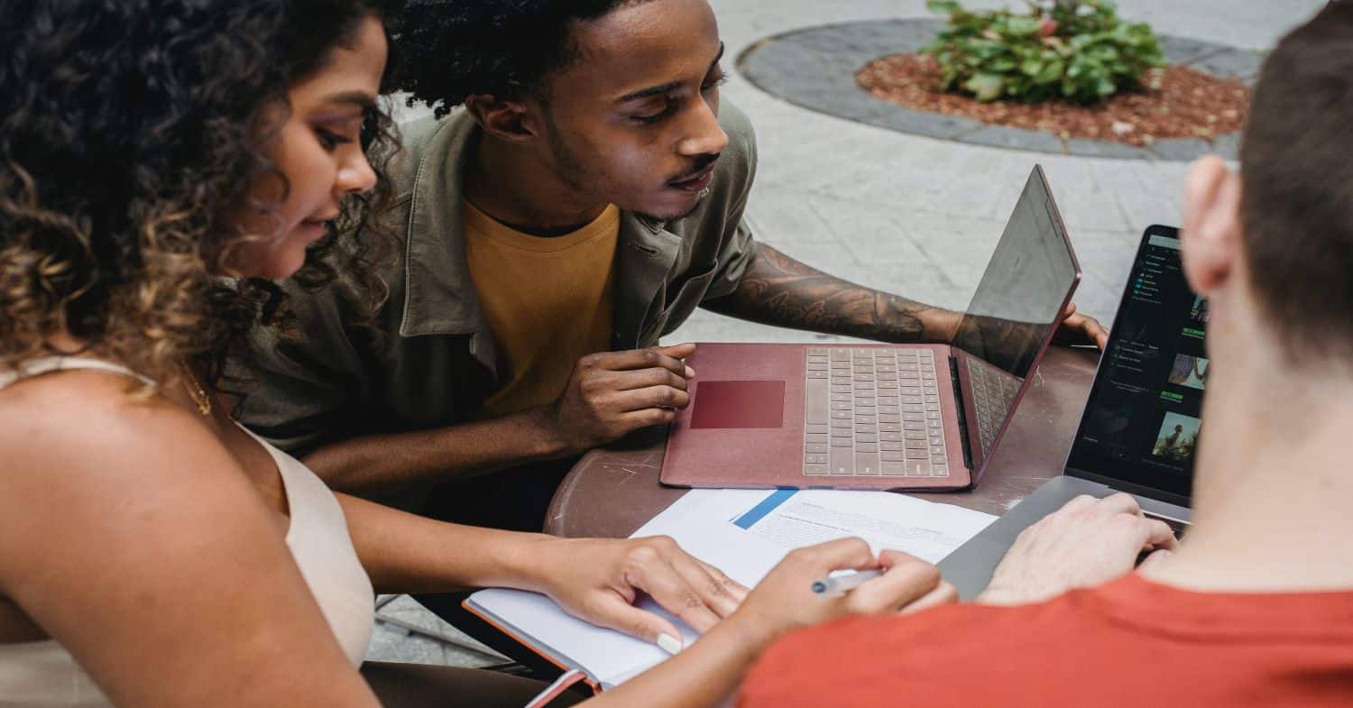 Young professionals working together on laptop